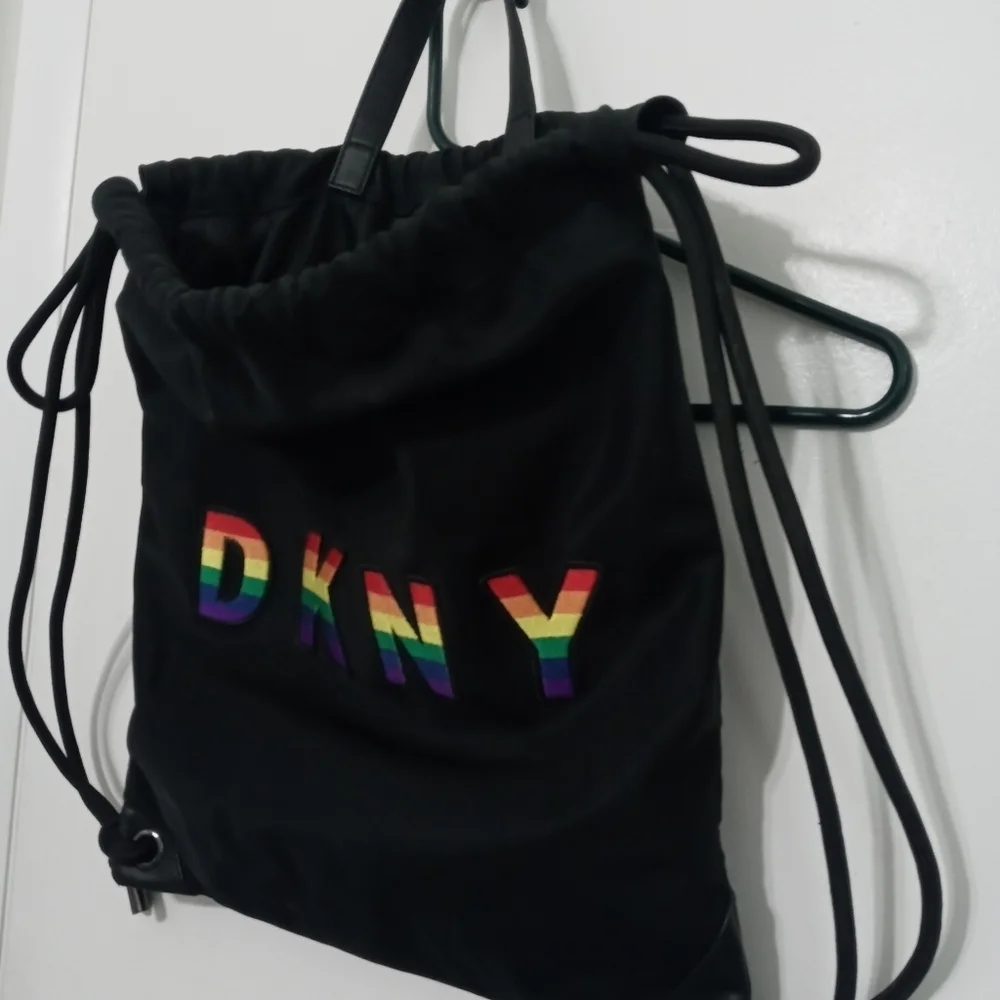 DKNY RAISED RAINBOW LETTER HEAVYWEIGHT DRAWSTRING BACPACK W MULTIPLE POCKETS